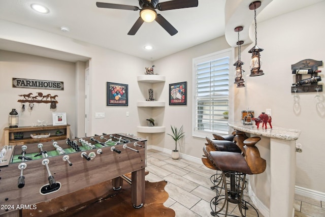 recreation room featuring ceiling fan