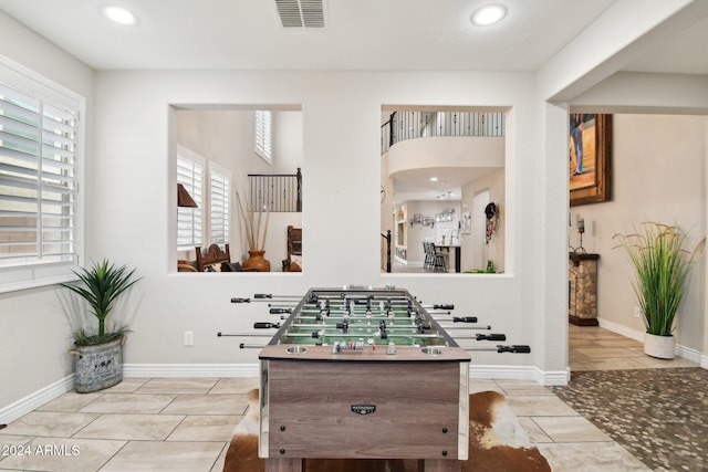 recreation room featuring light tile patterned flooring