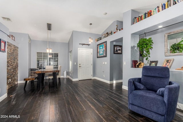 interior space with high vaulted ceiling and dark wood-type flooring