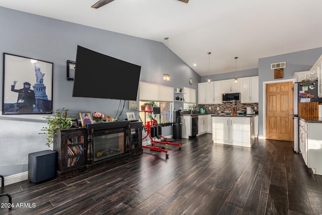 living room with lofted ceiling, sink, and dark hardwood / wood-style floors