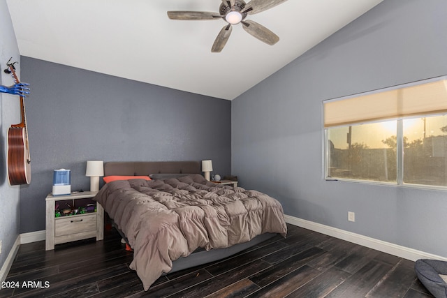 bedroom with ceiling fan, lofted ceiling, and dark wood-type flooring