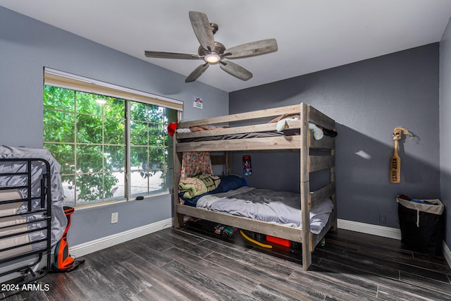 bedroom with ceiling fan and dark hardwood / wood-style flooring