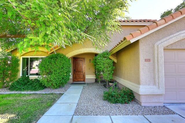 entrance to property featuring a garage