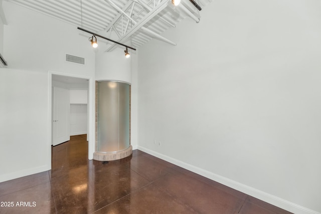 spare room featuring a high ceiling