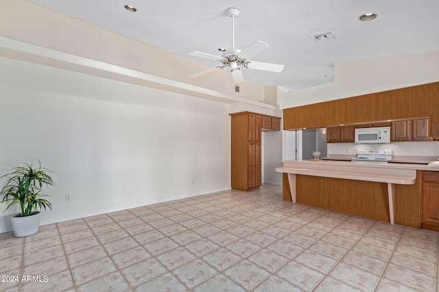 kitchen with high vaulted ceiling, ceiling fan, light tile floors, and stove