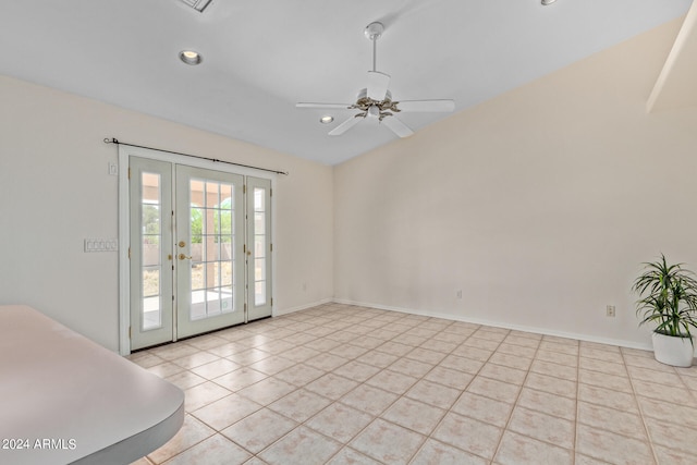 tiled spare room with ceiling fan