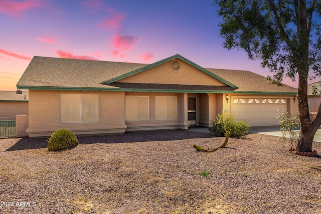 single story home featuring a garage