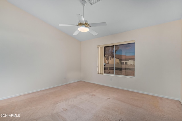 unfurnished room with ceiling fan and carpet flooring