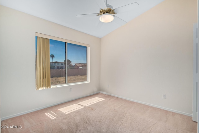 carpeted empty room featuring ceiling fan