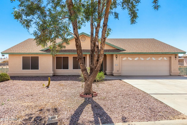 single story home featuring a garage