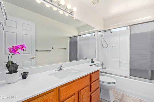 full bathroom with tile floors, combined bath / shower with glass door, toilet, and large vanity