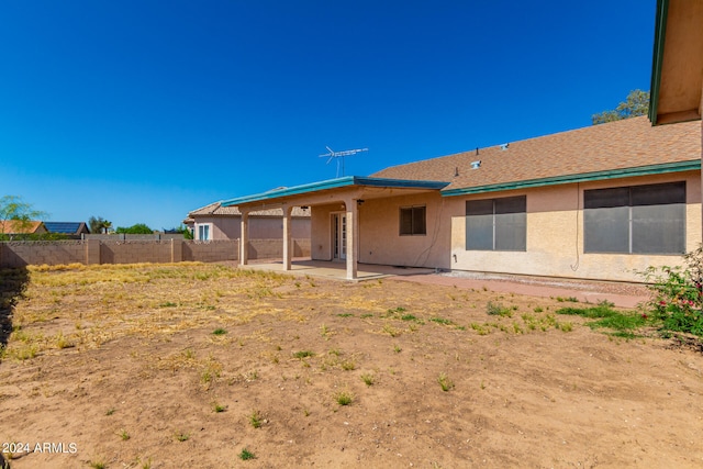 back of house with a patio