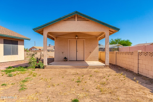 back of property with a patio area