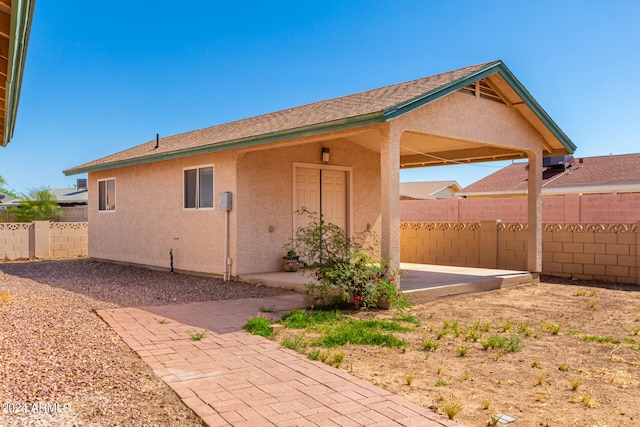 view of property exterior featuring a patio