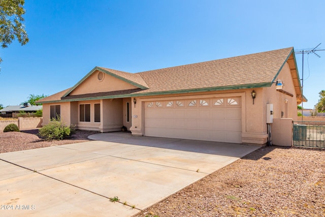 ranch-style home with a garage