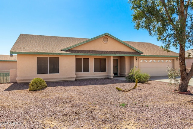 view of front of property with a garage