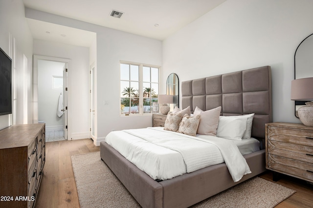 bedroom with light hardwood / wood-style floors