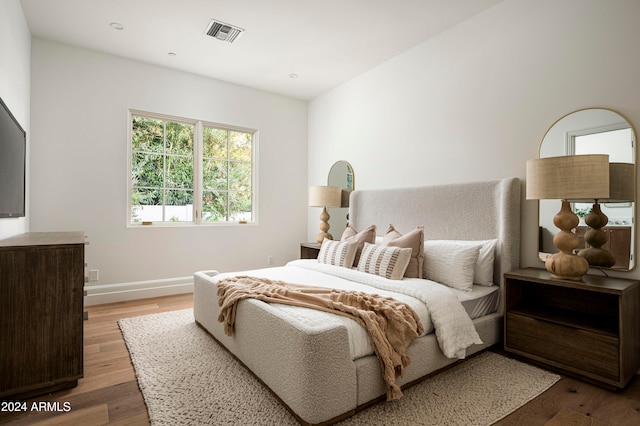 bedroom featuring wood-type flooring