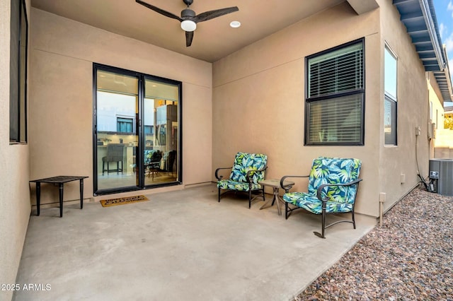 view of patio with ceiling fan and central AC unit