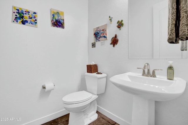 bathroom featuring toilet