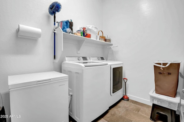 laundry room with washing machine and clothes dryer