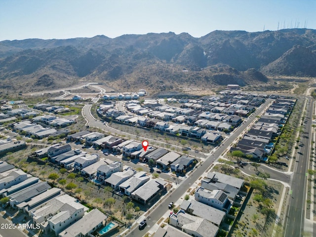 birds eye view of property featuring a mountain view