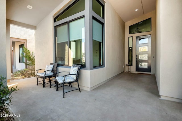 doorway to property with a patio