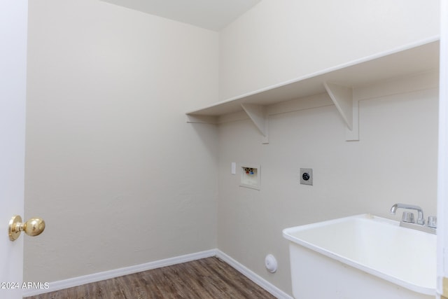 washroom with dark hardwood / wood-style floors, sink, hookup for an electric dryer, and hookup for a washing machine