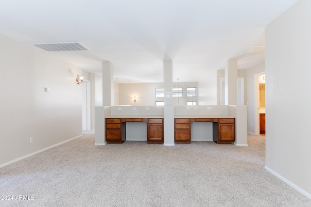 kitchen with light colored carpet