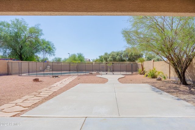 view of patio with a fenced in pool