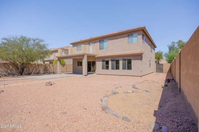 rear view of house featuring a patio