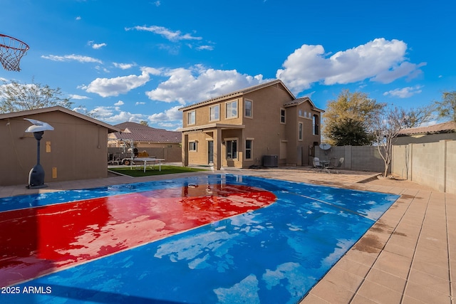 view of pool featuring central AC unit and a trampoline