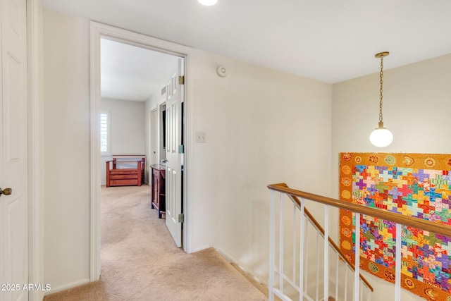 hallway with light carpet