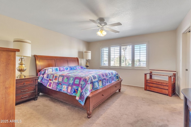 bedroom with light colored carpet and ceiling fan