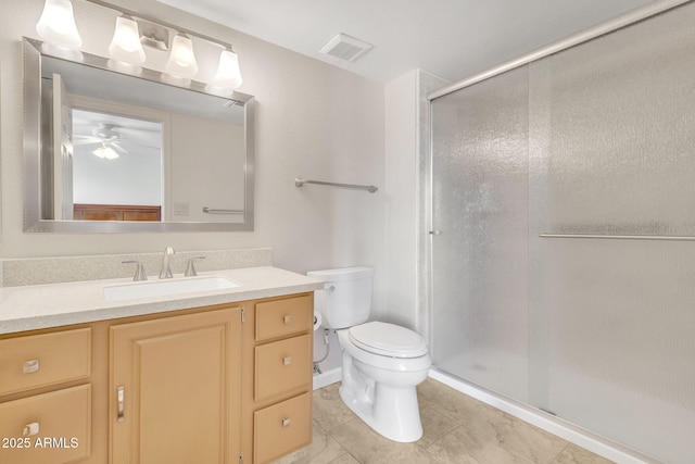 bathroom featuring vanity, toilet, tile patterned floors, and walk in shower