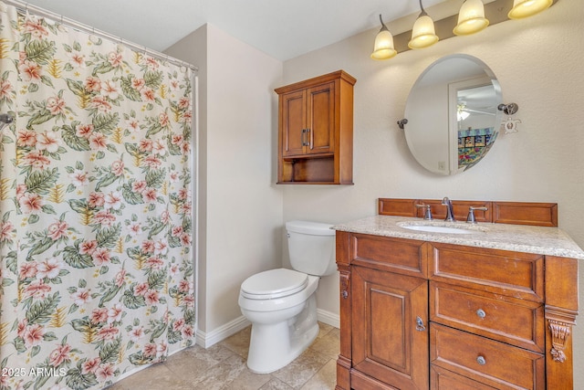 bathroom featuring vanity, toilet, and a shower with shower curtain