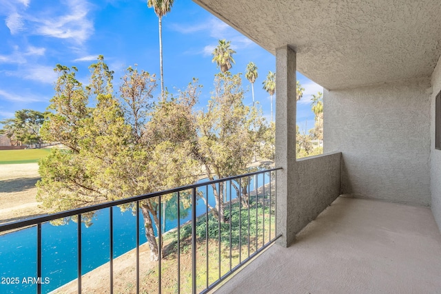 balcony featuring a water view