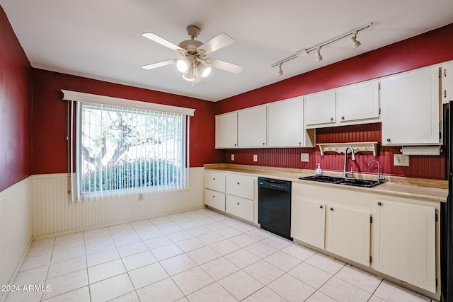 kitchen with white cabinets, sink, ceiling fan, light tile patterned floors, and black dishwasher