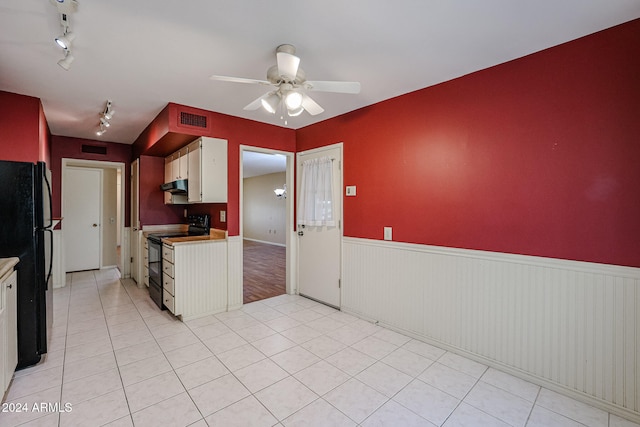 kitchen featuring white cabinetry, ceiling fan, track lighting, light tile patterned flooring, and black appliances