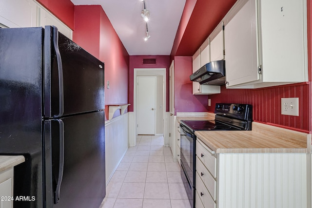 kitchen with track lighting, white cabinets, black appliances, and light tile patterned floors