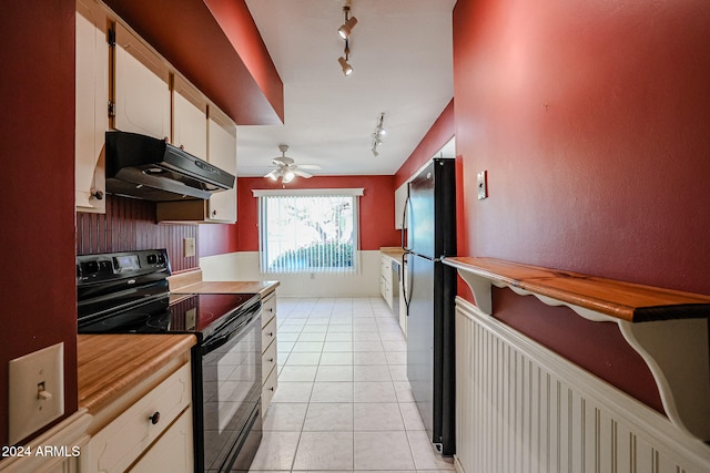 kitchen featuring track lighting, black appliances, white cabinets, ceiling fan, and light tile patterned floors