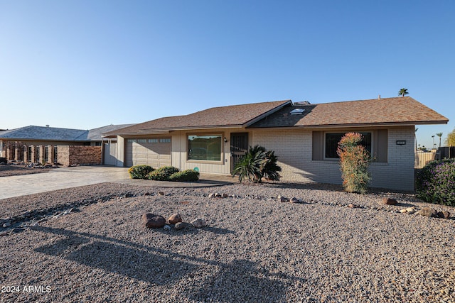 single story home featuring a garage