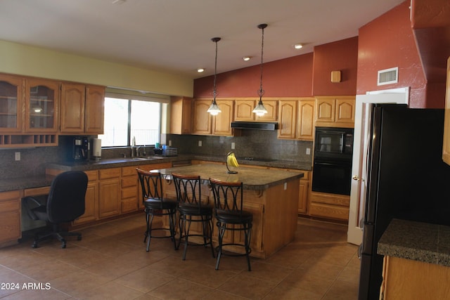 kitchen with a center island, tasteful backsplash, tile floors, black appliances, and pendant lighting