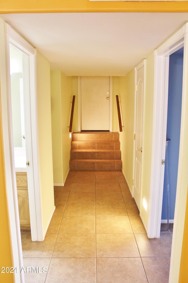 corridor with light tile floors