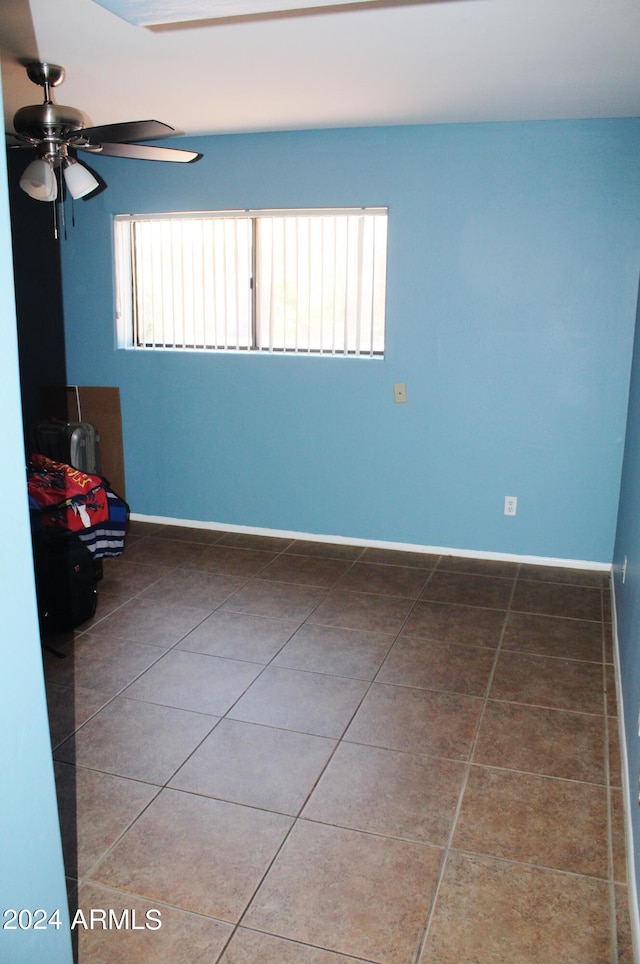 interior space featuring ceiling fan and tile flooring