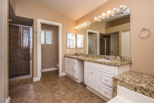 bathroom featuring lofted ceiling, a shower with door, vanity, and toilet