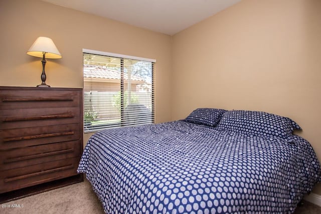 bedroom with light carpet