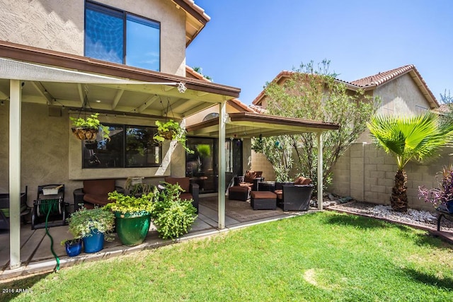 exterior space with a yard, an outdoor living space, and a patio