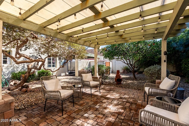 view of patio / terrace with fence and a pergola