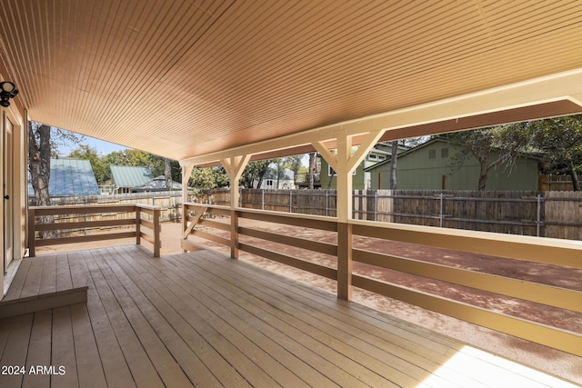 deck with a fenced backyard